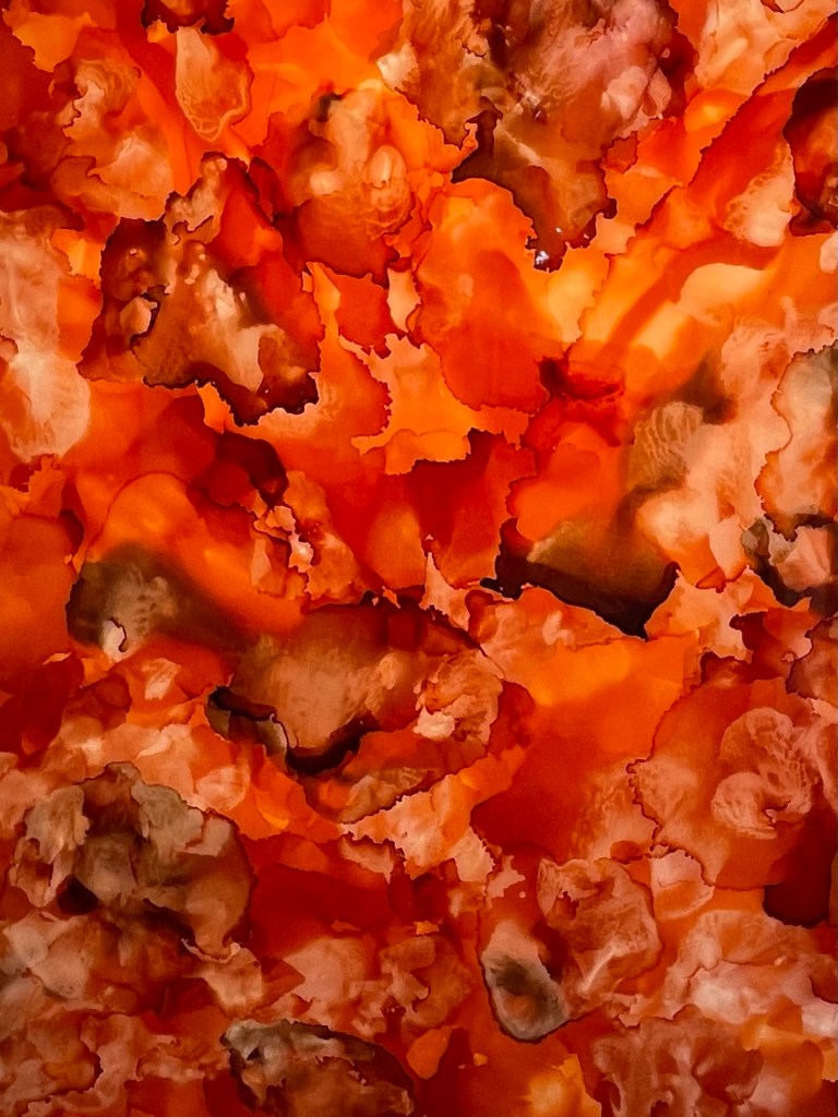 Design and Style Report image, Imani Bilal abstract painting with resin in orange and brown 